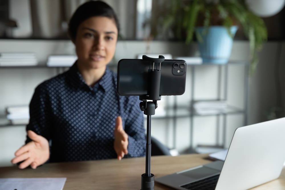 Woman creating video using smartphone