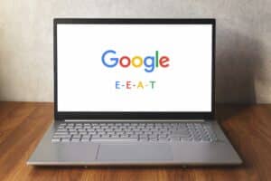 Laptop showing Google logo and E-E-A-T