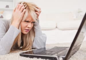 Frustrated woman with laptop